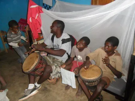 Clement drumming with children at Redemption Children's Home in Damongo, 2009