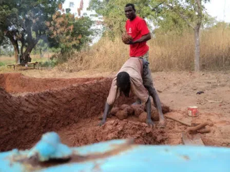 Clement and his friend Bugri building the third attempt of Dream Village in Damongo, 2009